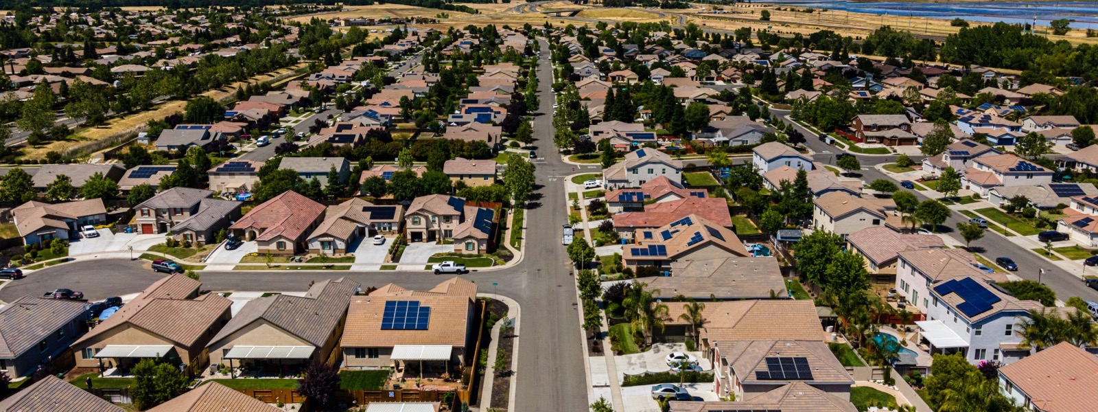 Aerial view of a California suburban neighborhood with red-tile roofs